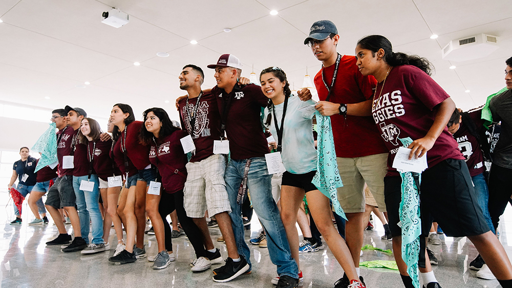 Student sway to the Aggie War Hymn. 