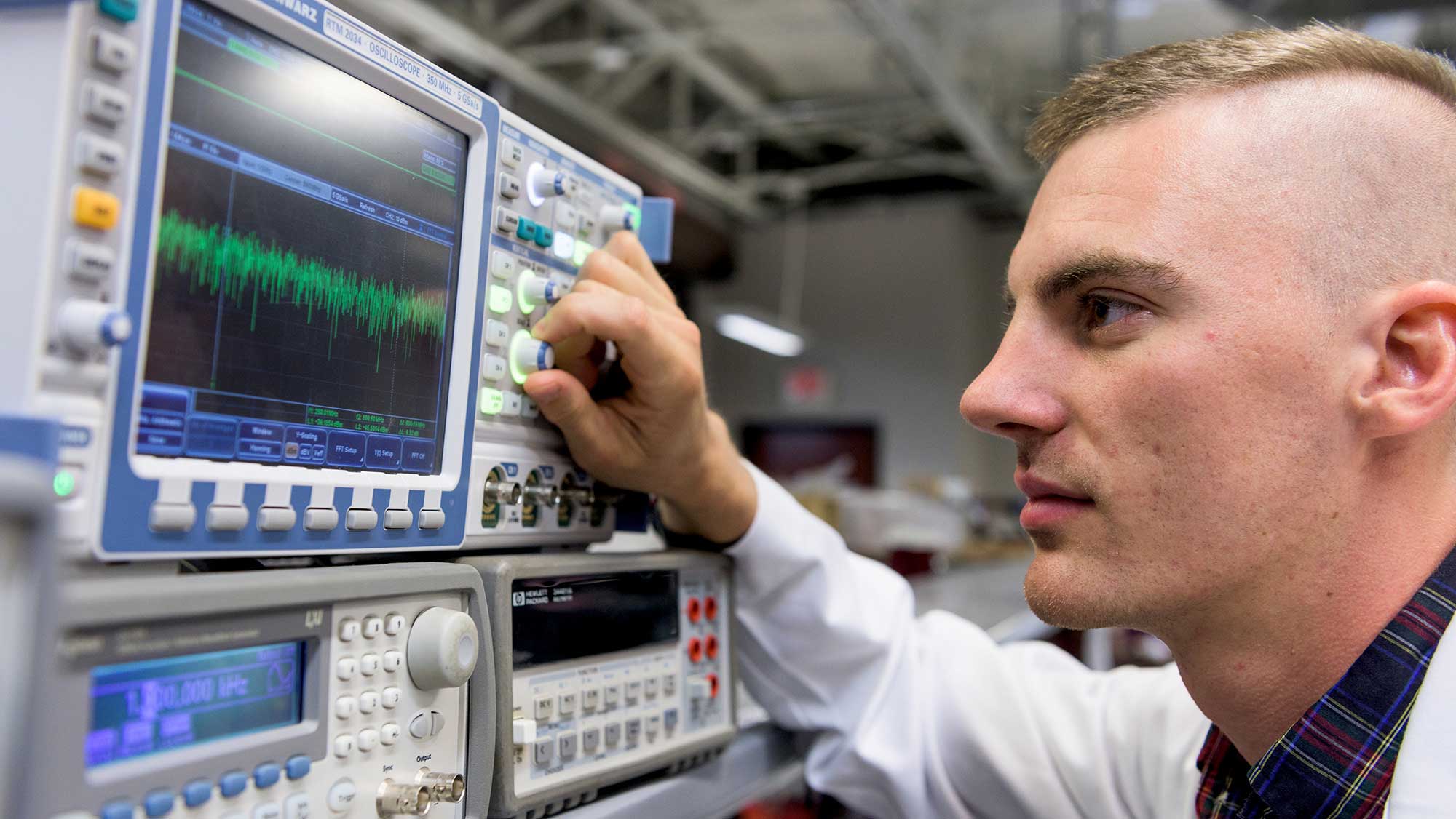 biomedical engineering student using an oscilloscope