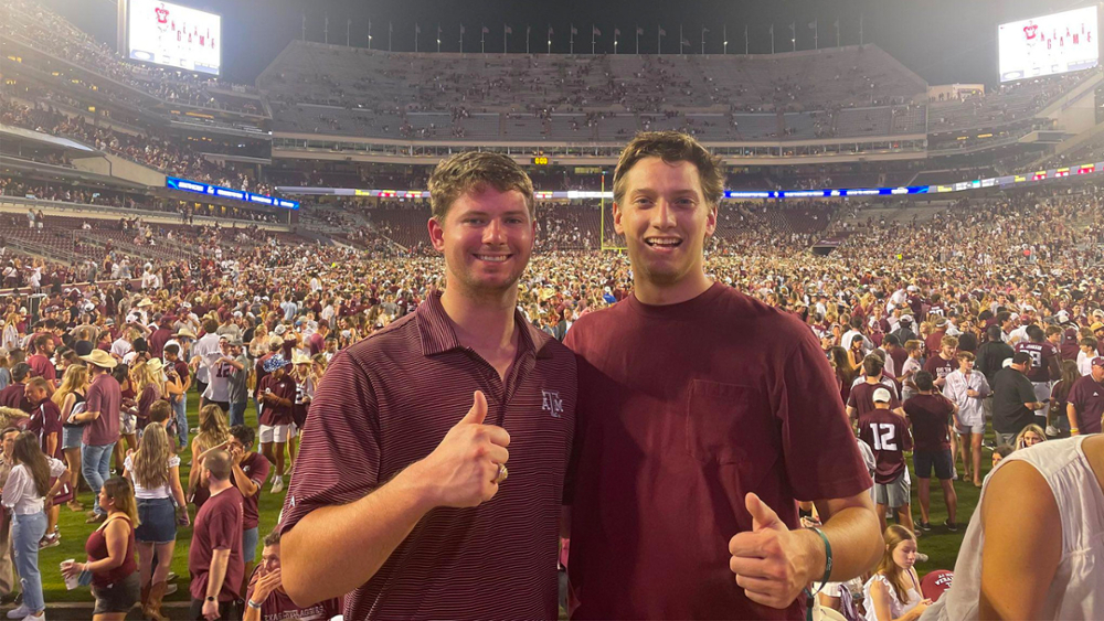 Brent Whitehead and Matt Lohstroh at a football game