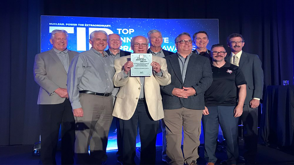 A group of industry and educational leaders receive the Nuclear Energy Institute's Top Innovation Practice Award of 2018.