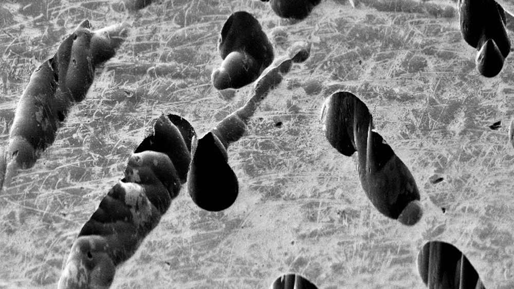 SEM microscope scan of nickel showing corrosion trenches.