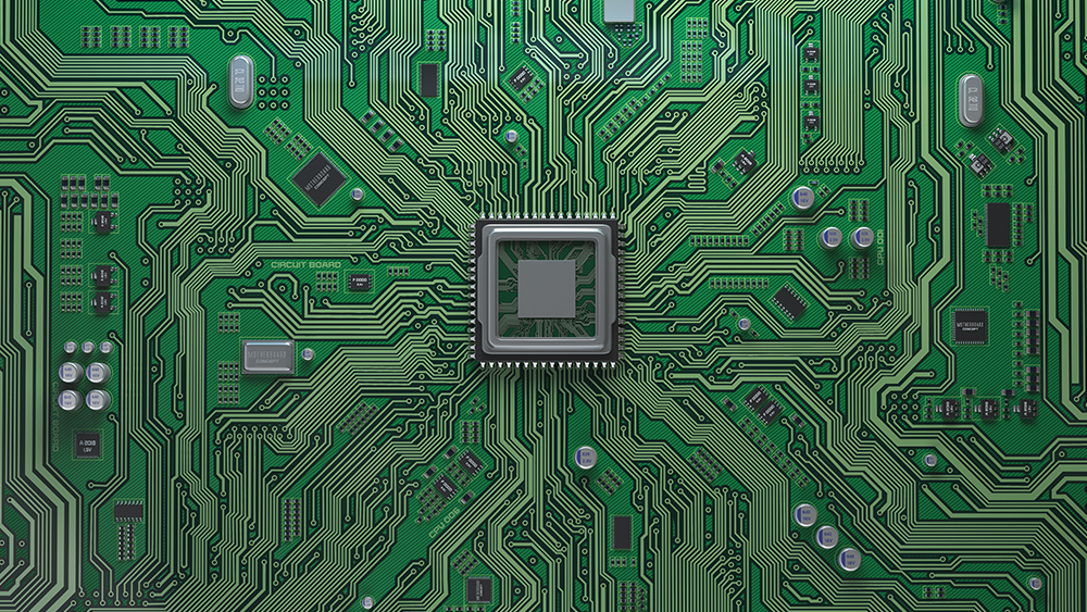 A close-up of a motherboard with a microchip centered in the middle. 