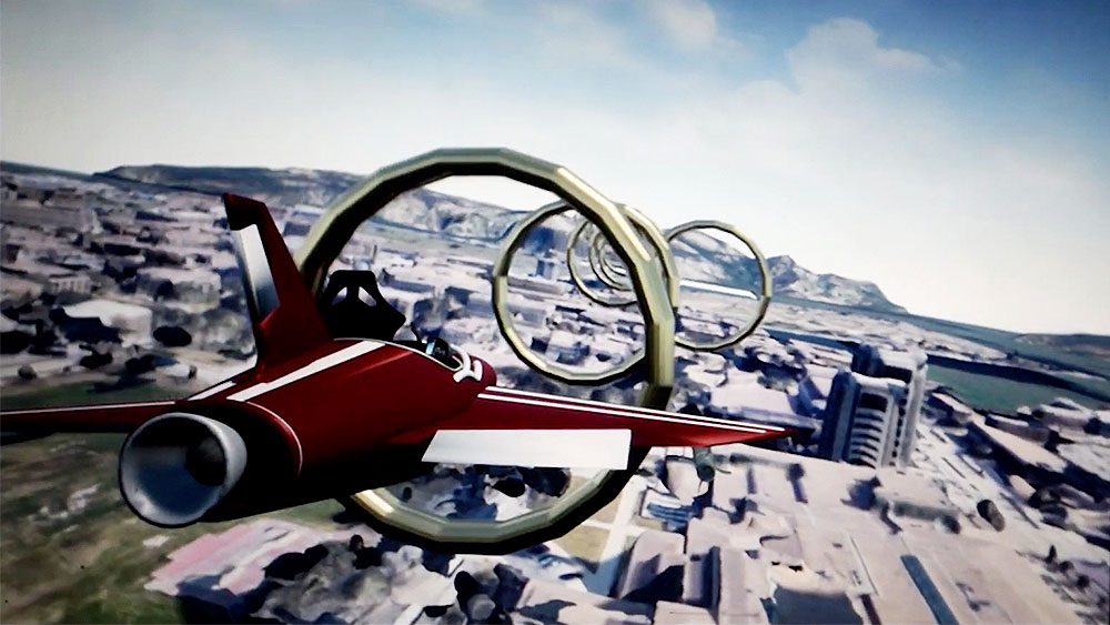 Screenshot of a virtual reality flight simulation showing a maroon and white aircraft flying through large golden rings above a map of Texas A&M University.