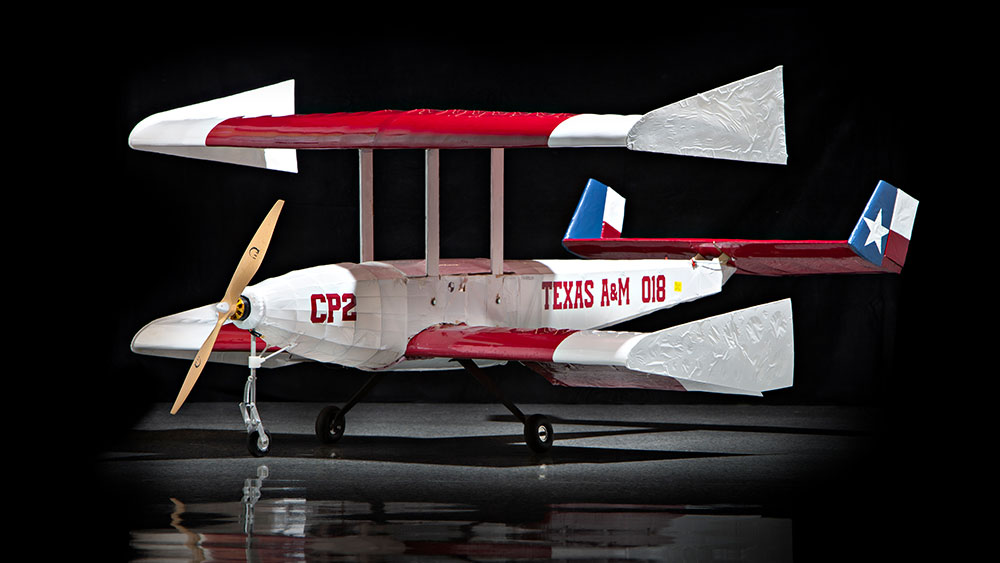 Red, white and blue Texas flag-themed biplane remote-controlled aircraft.