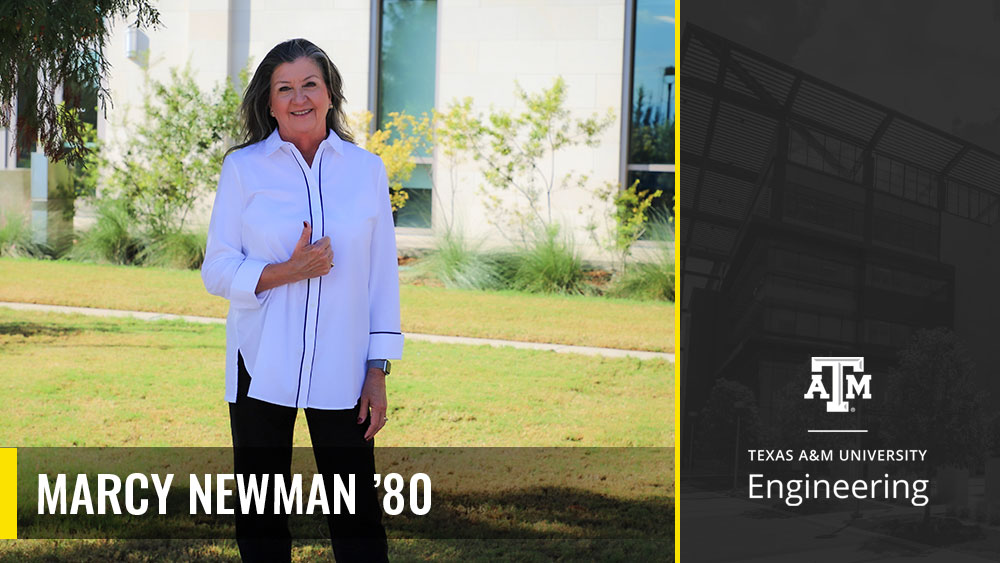 Marcy Newman standing outside in front of the Zachry Engineering Education Complex doing a thumbs up. 