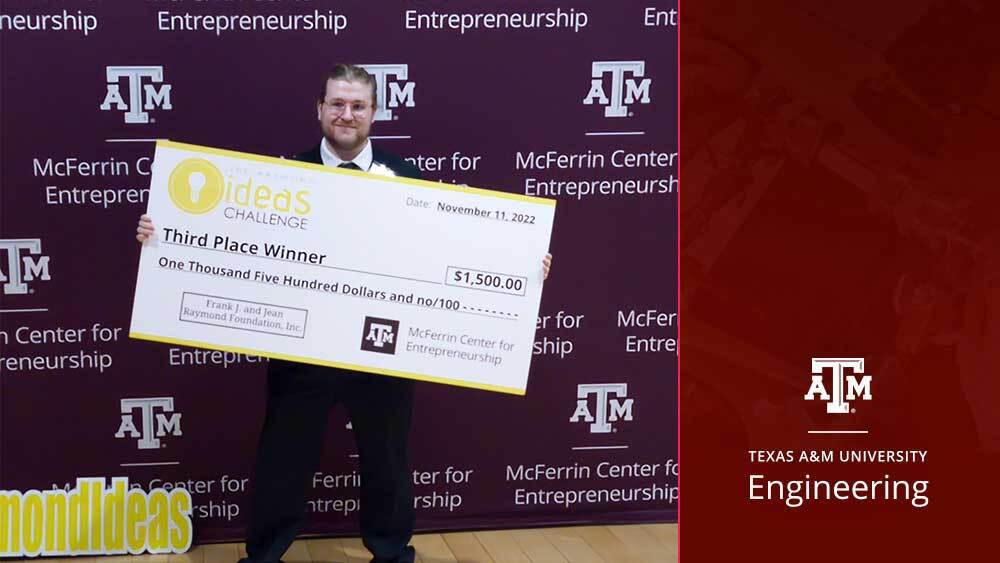 Dillon Caldwell holds his $1,500 check from the Raymond Ideas Challenge.