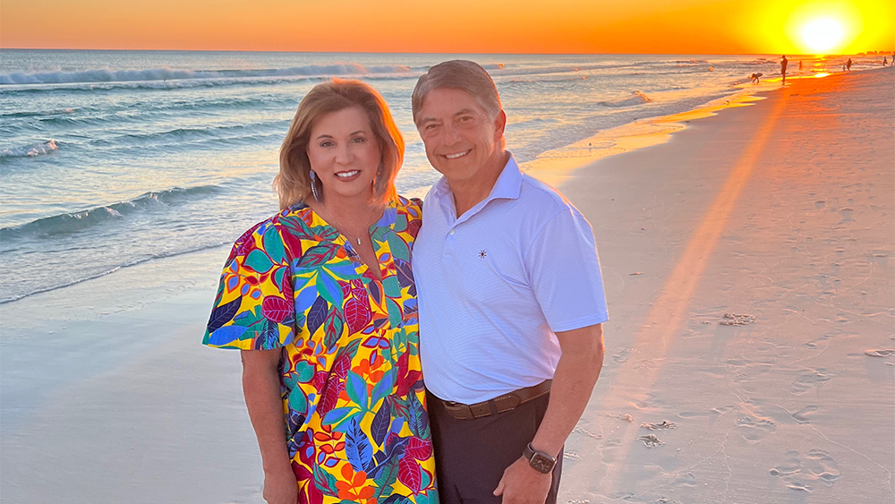 Fred and Cindy Balda on a beach.