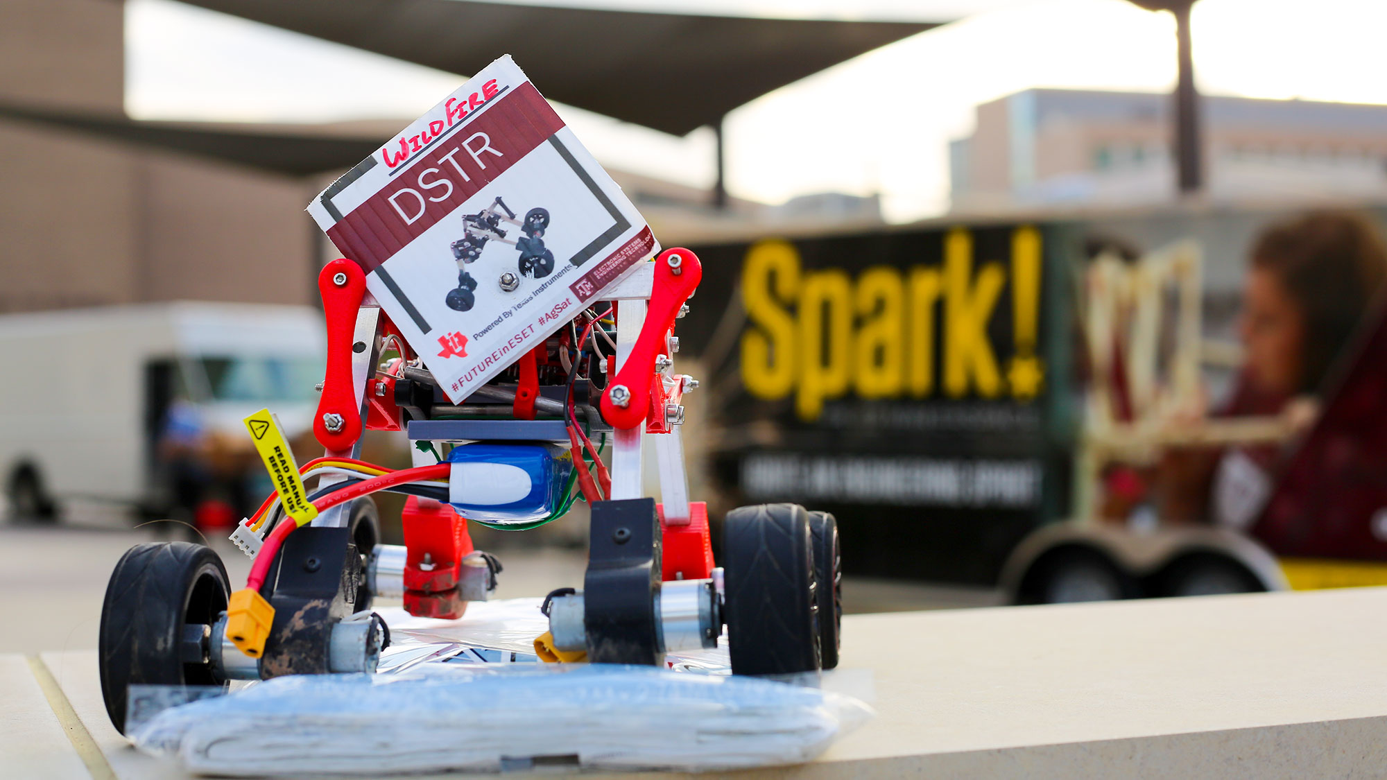 Robot car and Spark! truck in the background