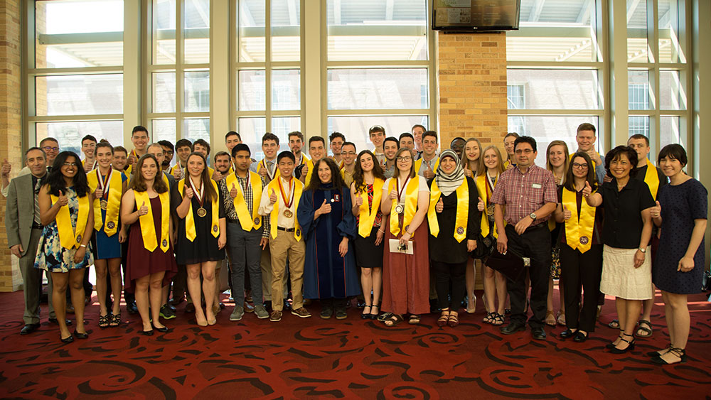 Engineering Honors students pose for a photo after graduation