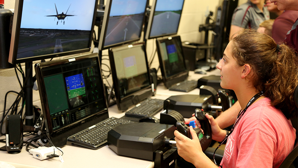 Camp SOAR participant controlling a simulated jet plane.