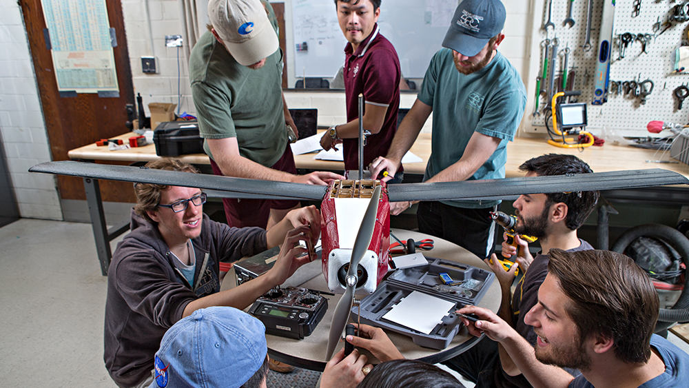 Aerospace students working on capstone design plane