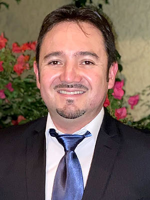 Professional headshot of Felipe Guzman.