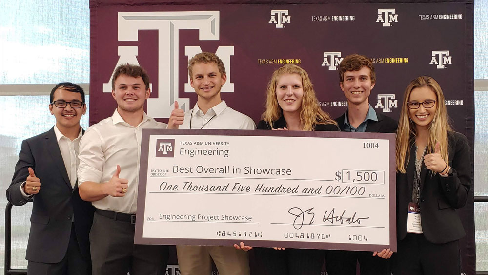 Six students with their best overall showcase check from their capstone project.