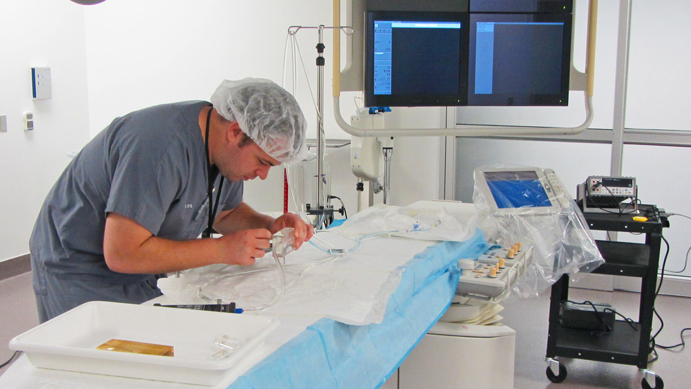 Student working in surgical suite