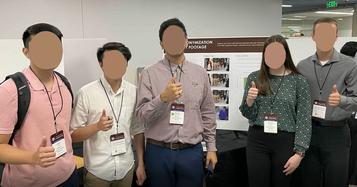 A group of students are standing in front of a poster board for their project. All of their faces are blurred out and they are giving a gig 'em hand sign.