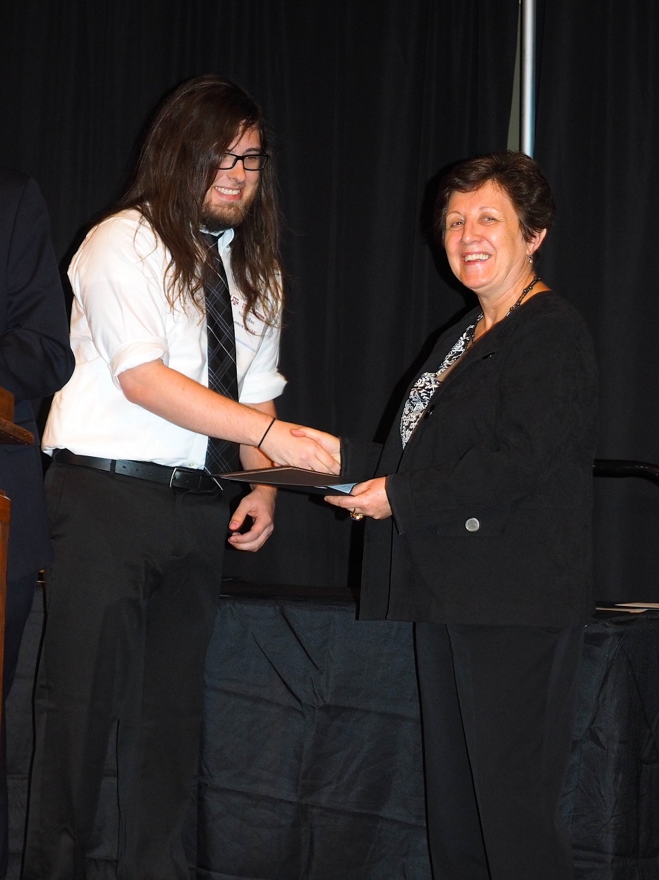 Spring 2016 student receiving award from faculty