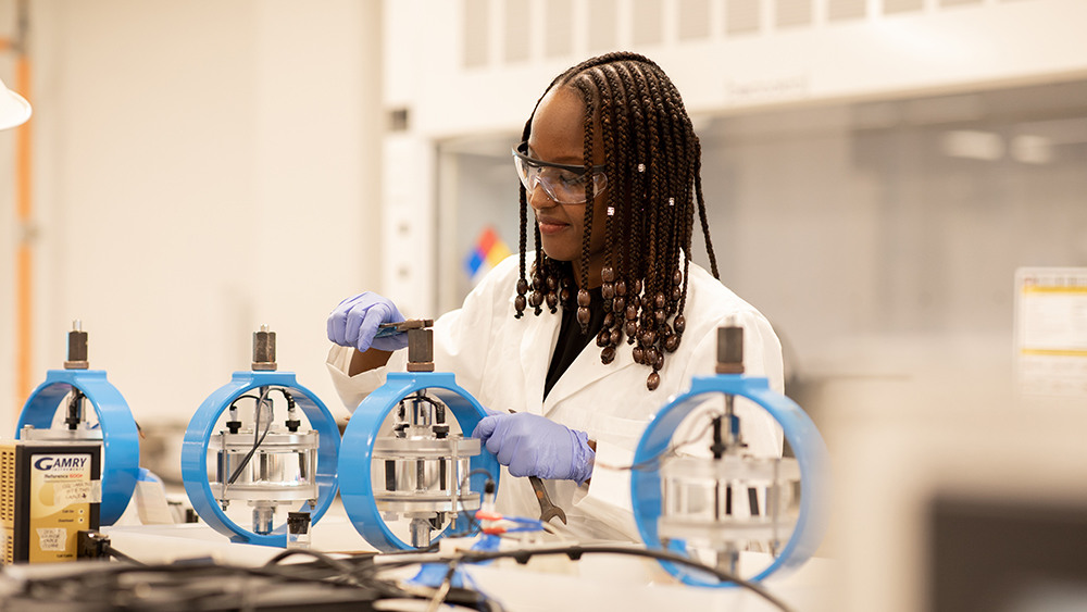 A female graduate student works in the lab. 