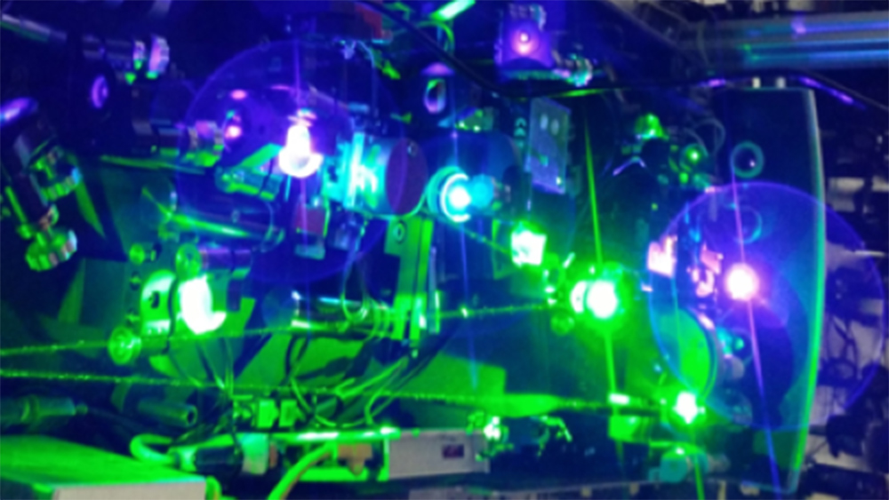 Photonics laboratory equipment with several bright lights.