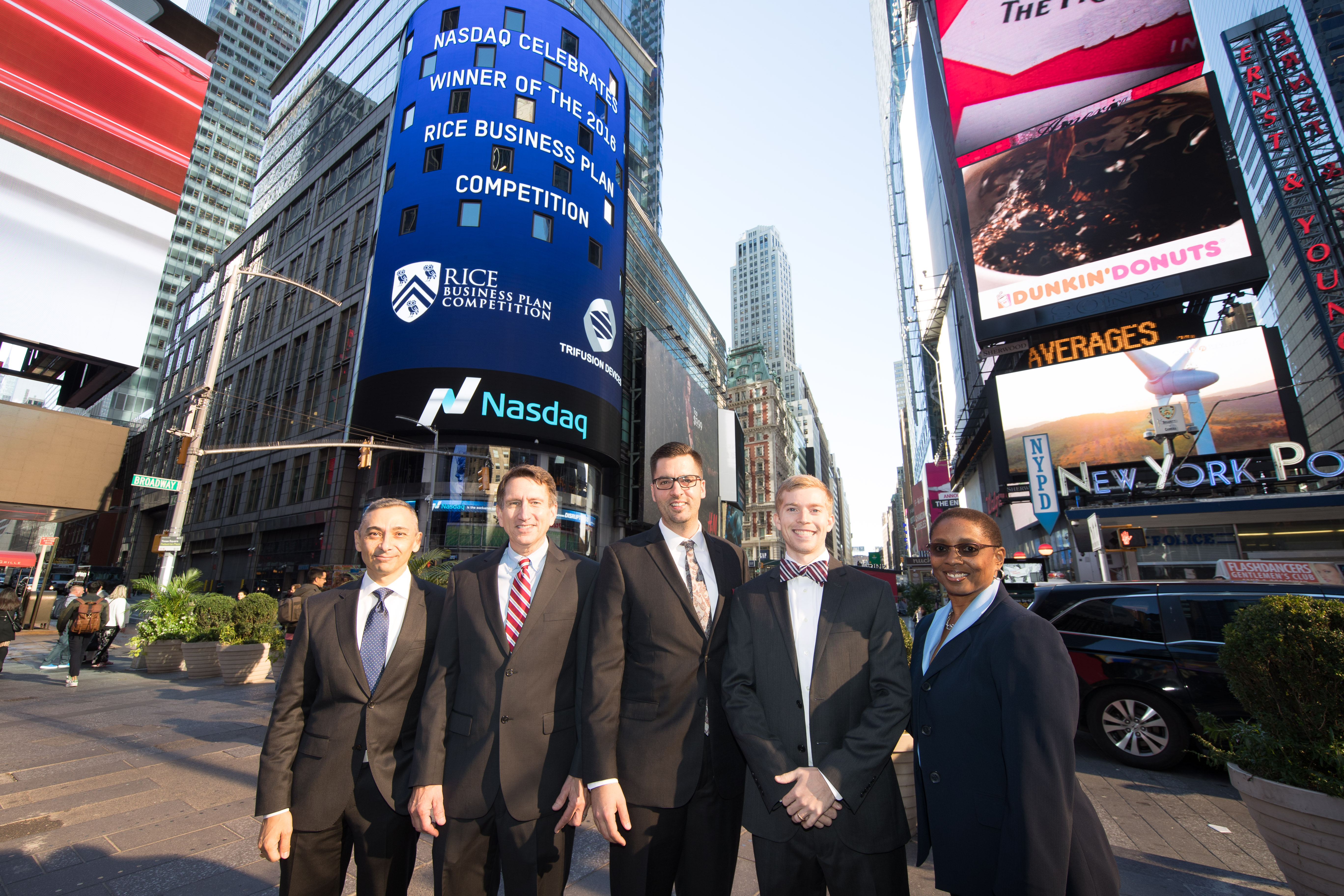 Pictured in front of the Nasdaq MarketSite in Times Square are Peter Rodriguez, Brad Burke, Blake Teipel, Brandon Sweeney,  Gene Birdwell; and Dr. Valerie Taylor