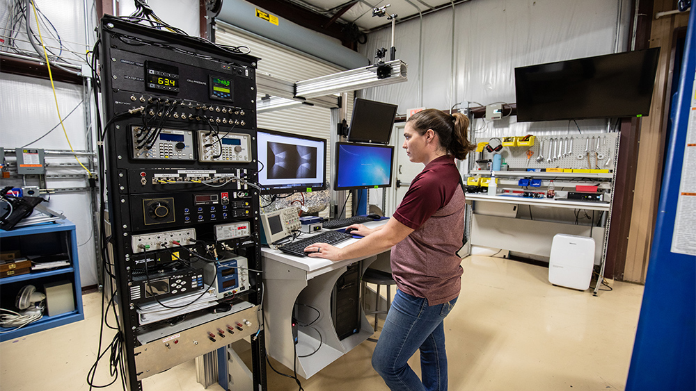 Aerospace graduate student Brianne McManamen working in the National Aerothermochemistry Laboratory at Texas A&amp;M