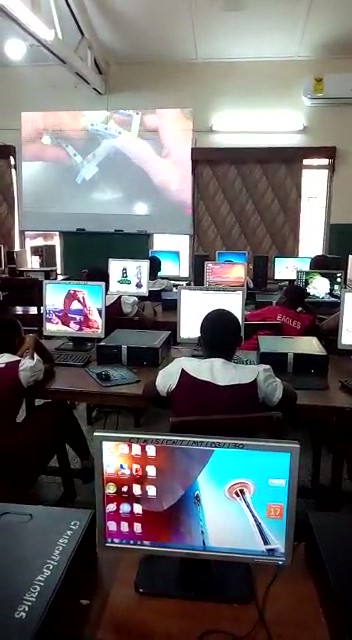 Girls in Ghana study robotics.