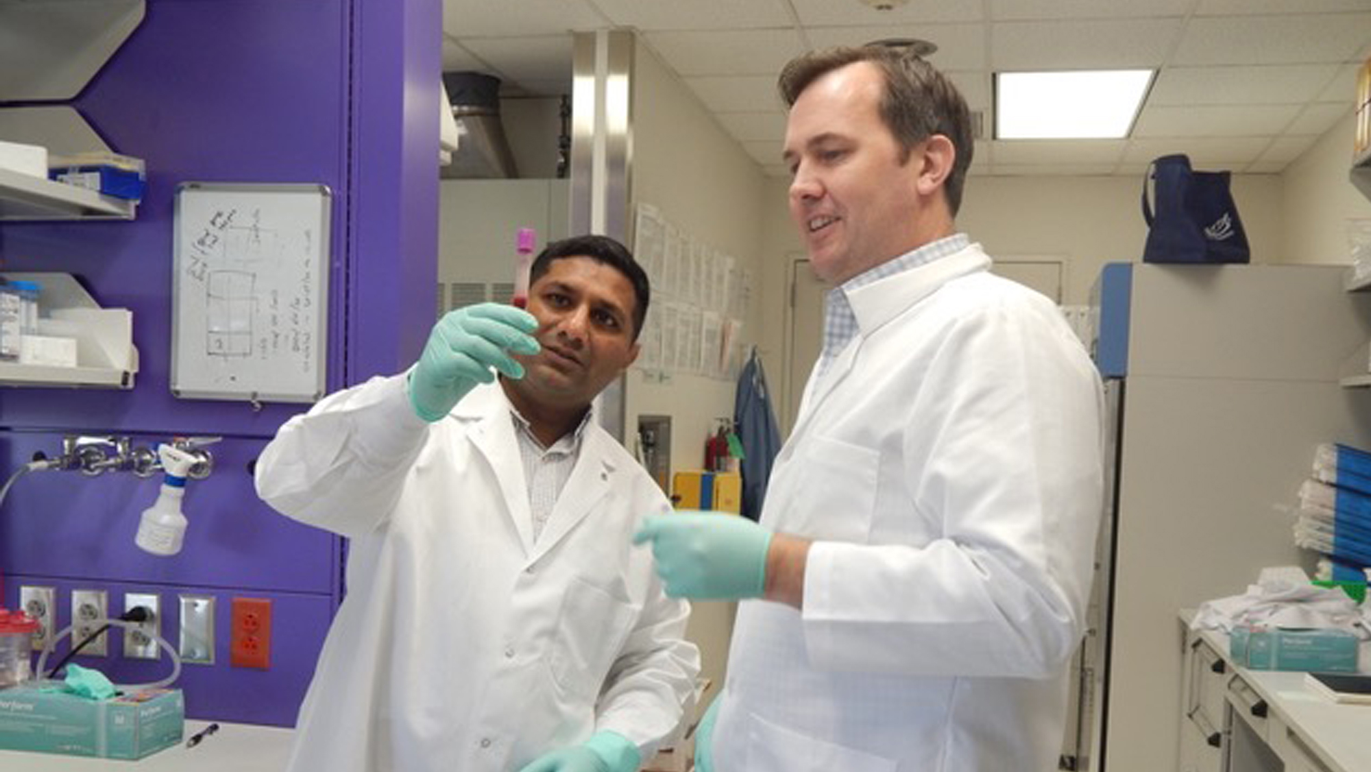 Dr. Abhishek Jain from Texas A&M University and Dr. Jonathan Flanagan from Texas Children’s Hospital and Baylor College of Medicine collaborate in the lab in Houston.
