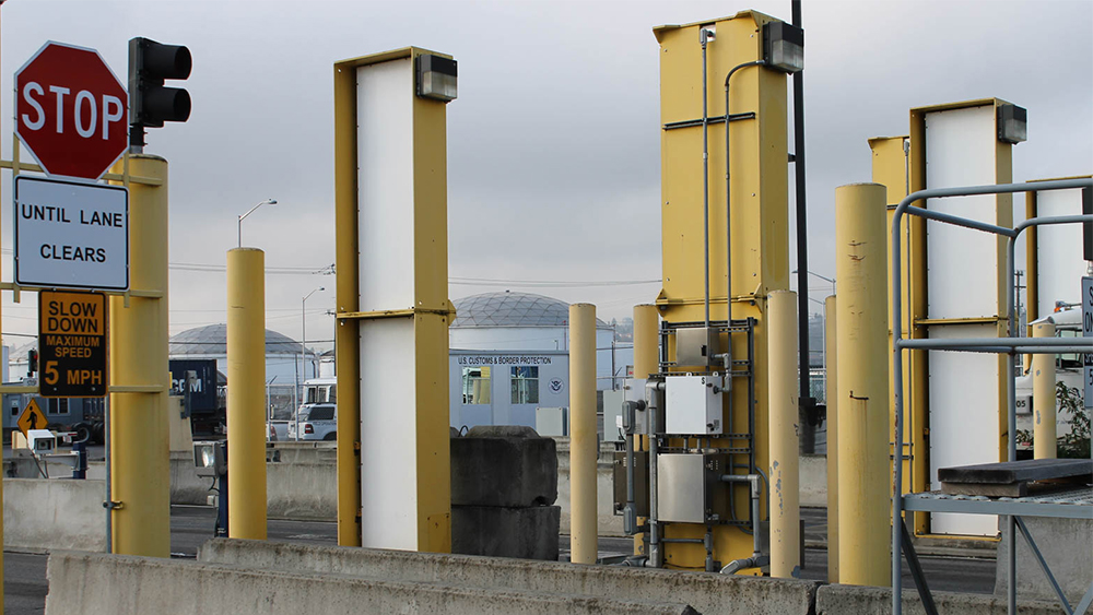 Radiation detection portal monitors at a border crossing.