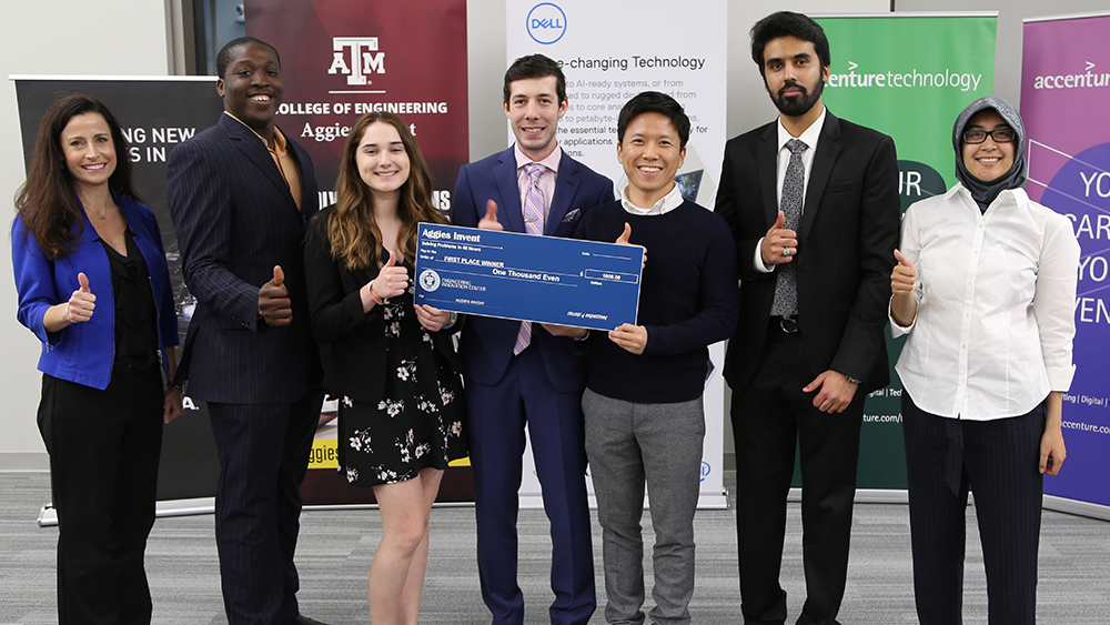 The winners of Aggies Invent: AR/VR pose for a photo with Leslie Harlien (far left), Vice President at Dell EMC. 