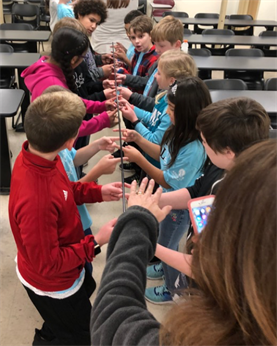 fourth grade students take part in science demonstration given by engineering technology and industrial distribution department at Texas A&M