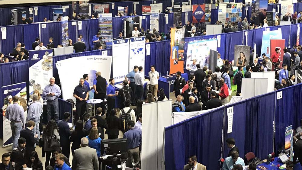 Aerial view of recruiter booths at career fair in Reed Arena.