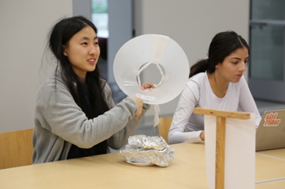 Students brainstorm an alternative for the cone of shame.
