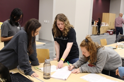 Students plan how to solve a problem during Aggies Invent.