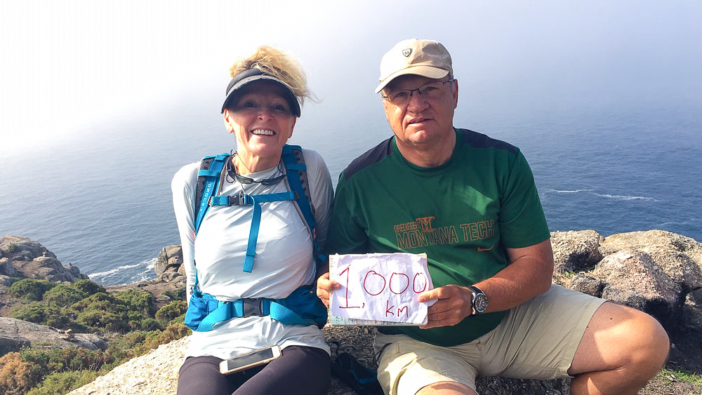 Michael '80 and Heidi Gatens sitting together on a mountain outlook