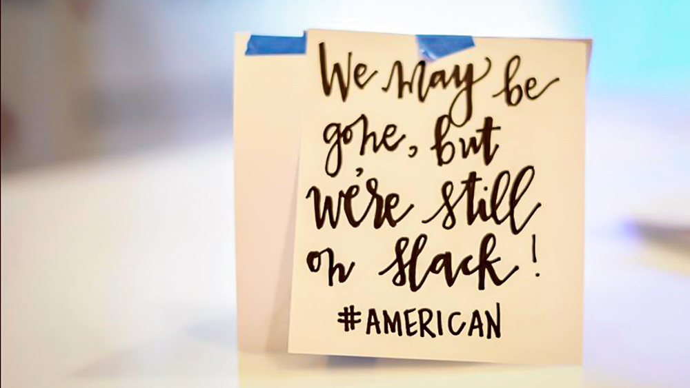 Image of a written note: "We may be gone, but we're still on Slack! #AMERICAN"