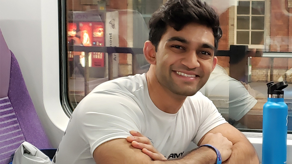 A former student, Ravi Lad, smiles for the camera