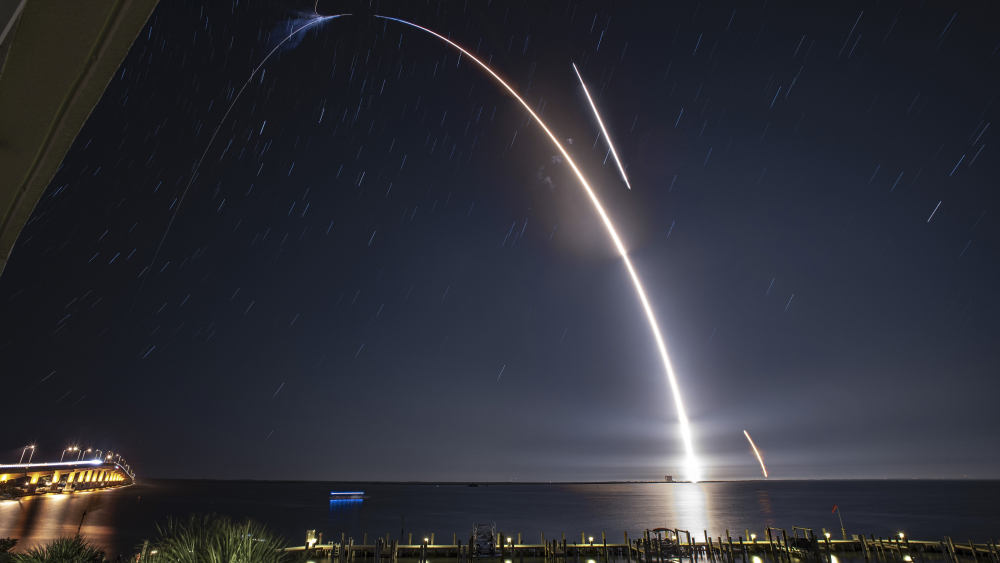 A panorama of the SpacEx Falcon 9 launch from a distance.