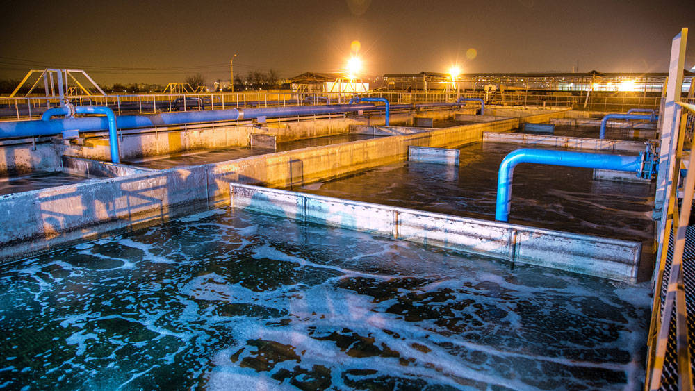 Modern wastewater treatment plant of chemical factory at night. 