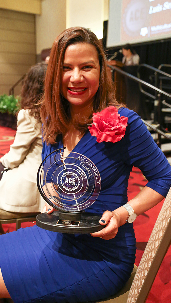 Dr. Sonia Garcia holds an award