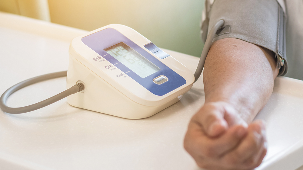 Blood pressure being taken using a blood pressure cuff. 