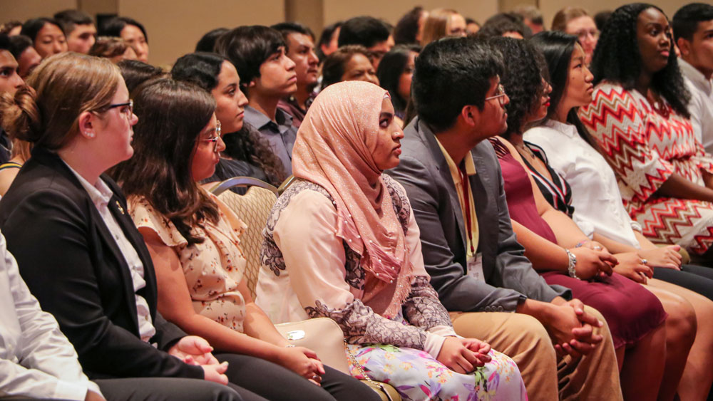Incoming first generation students in the audience at the summer bridge program closing ceremony