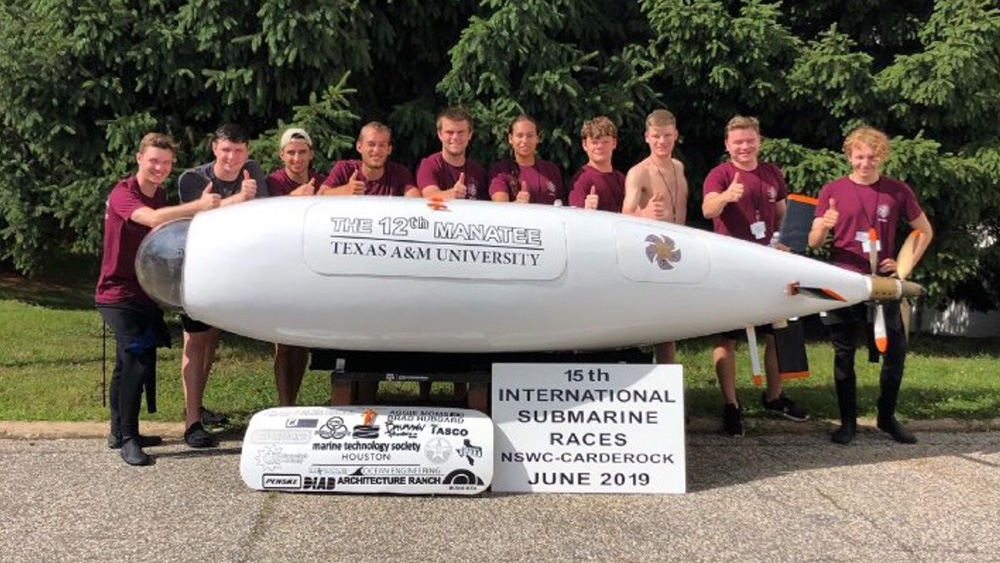 The 2018-2019 Human Powered Submarine team gathers behind the submarine.