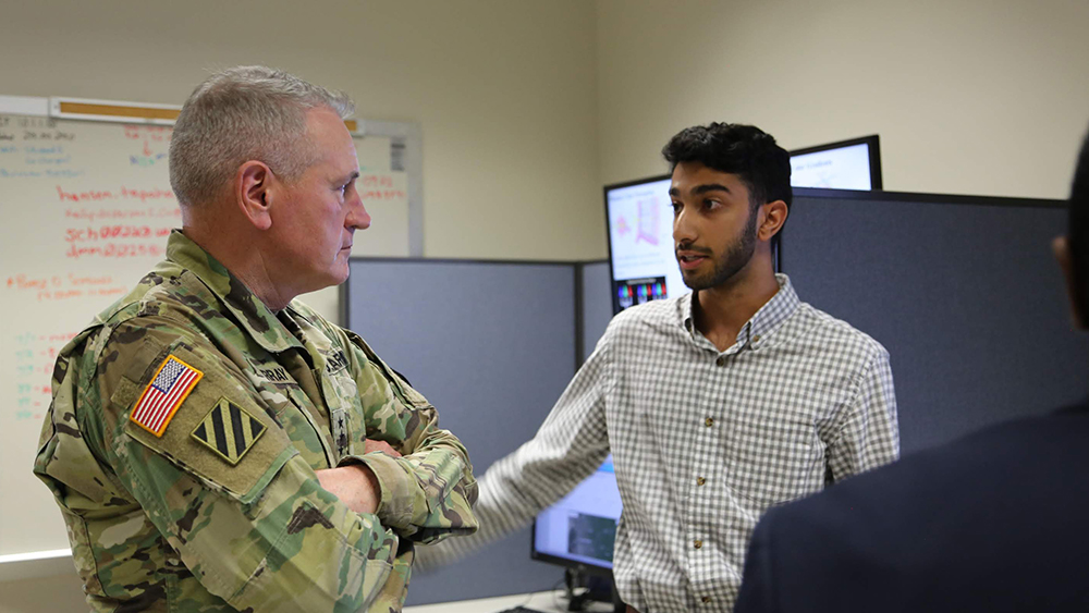 Student speaks with Army General. 