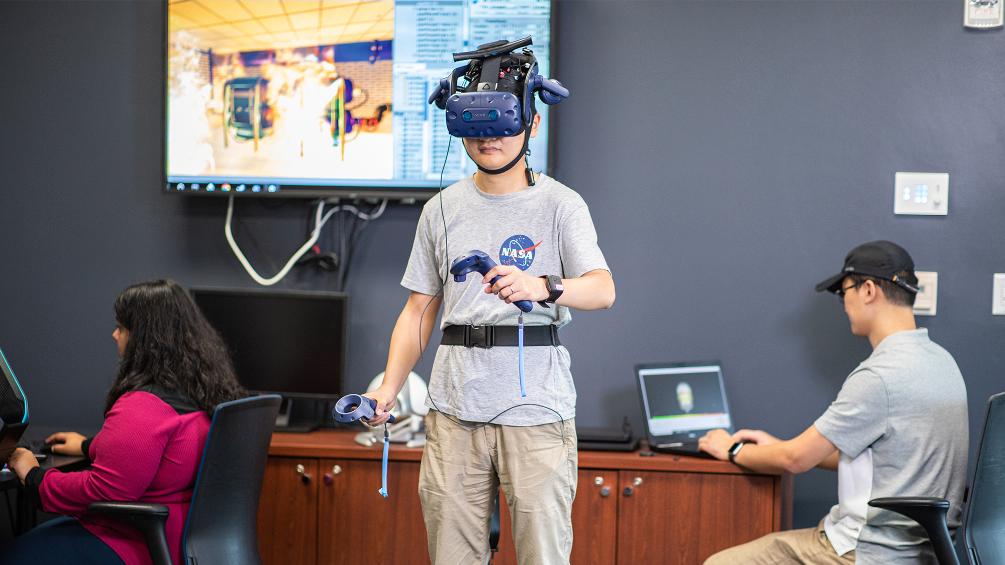 Student using virtual reality headset in simulation. 