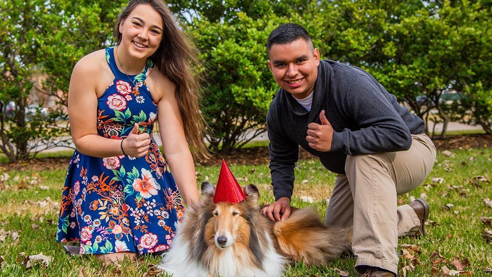 Kaya Mariello and friend pose with Reveille. 