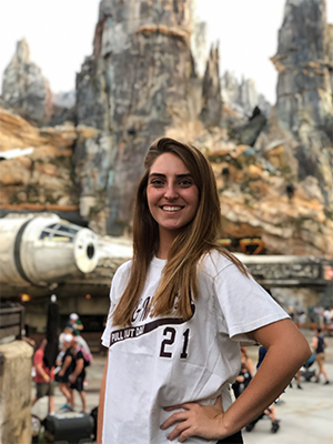Stephanie Cruz stands in front of the Star Wars World at Walt Disney World resort. 
