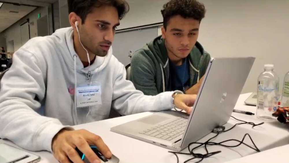 Rushi Patel and teammate working together in the Boeing Innovation Challenge
