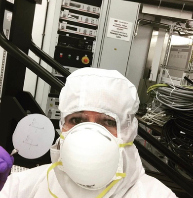 Male student wearing personal protective equipment in the lab
