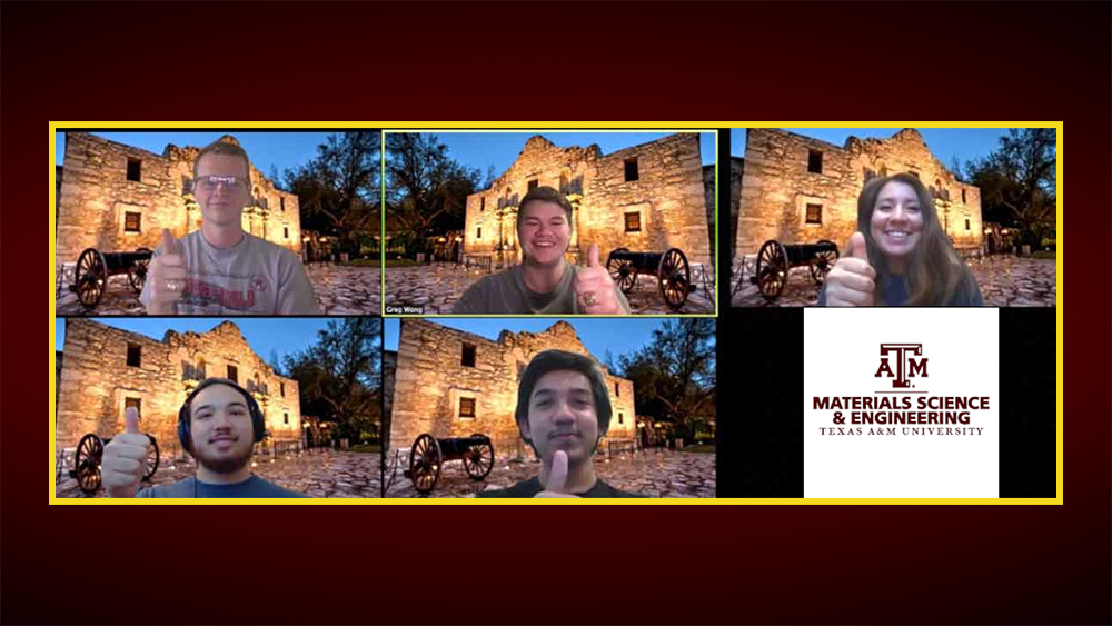 Five members of the winning team all give the thumbs-up hand gesture in a video conference call. Each member is inside a square as part of a grid and have the Alamo building as their backdrop.
