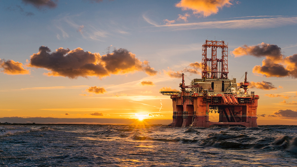 offshore oil rig at sunset.