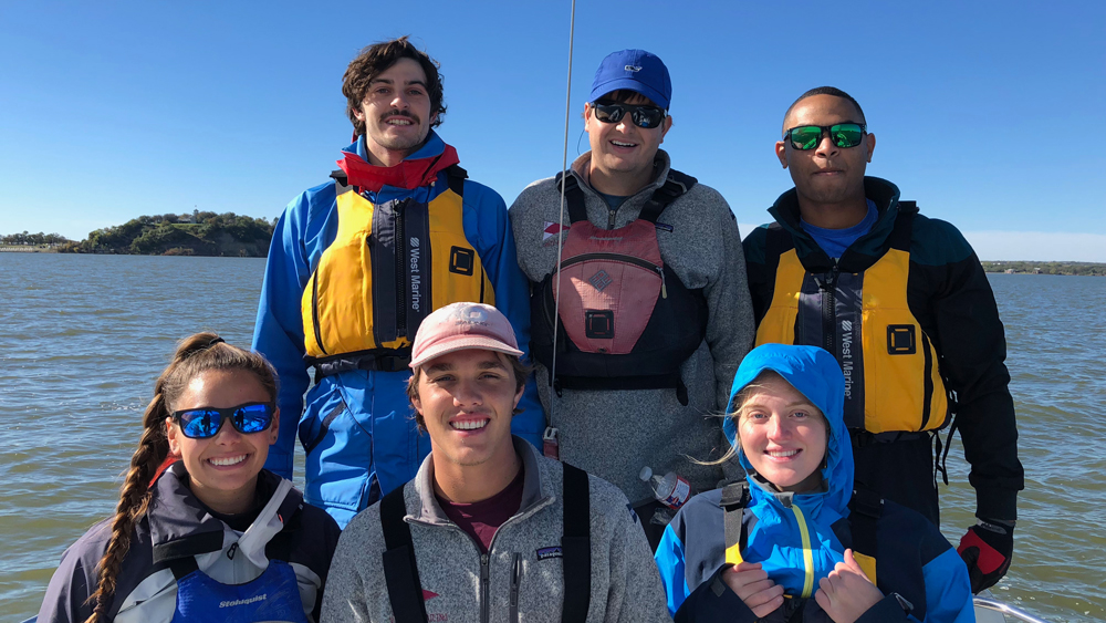 A group of ocean engineering students on a boat
